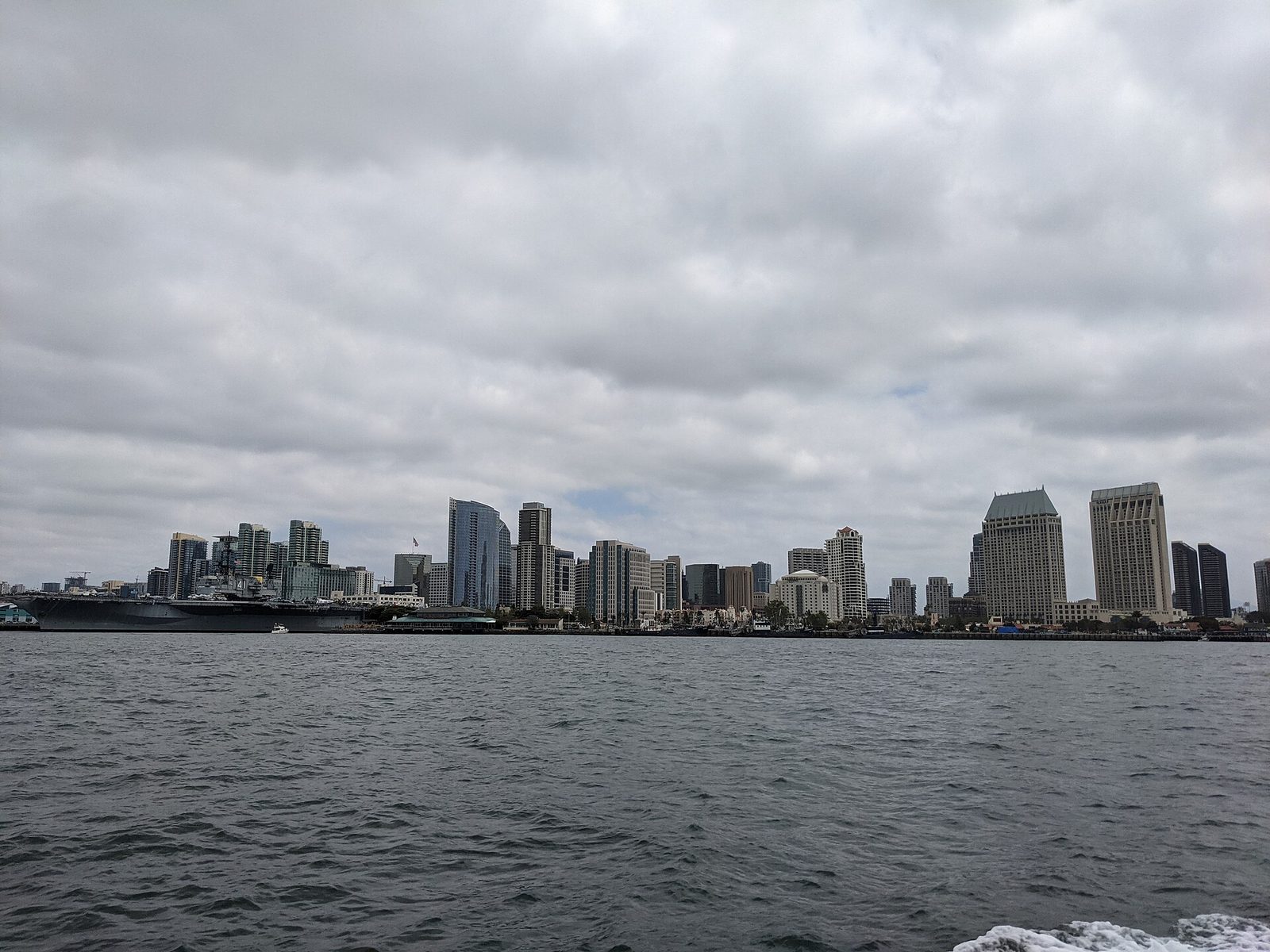 Downtown seen from the bay, the USS Midway museum at the waterfront. City hall and county government both work from downtown.
