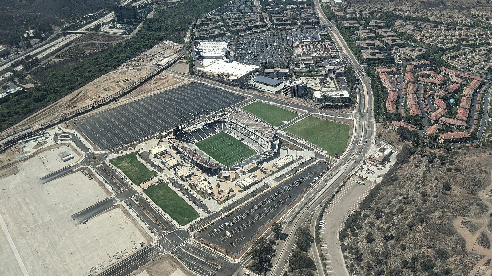 Snapdragon Stadium from the air in August 2022, the month the Mission Valley stadium opened. The Old Oil Can, the trophy awarded in the San Diego State and Fresno State rivalry, stays on this campus for another year.