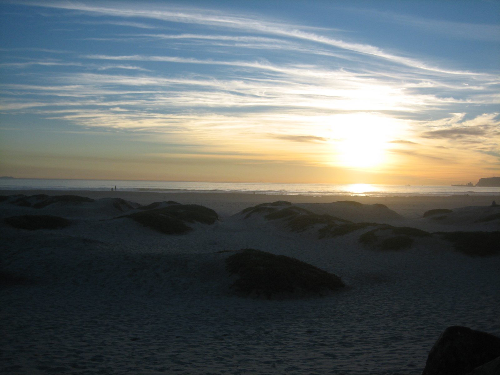 Coronado Beach at sunset. The grounded sailboat lay near Coronado in water too shallow for the responding boat crew, which is why the rescue fell to a helicopter swimmer.