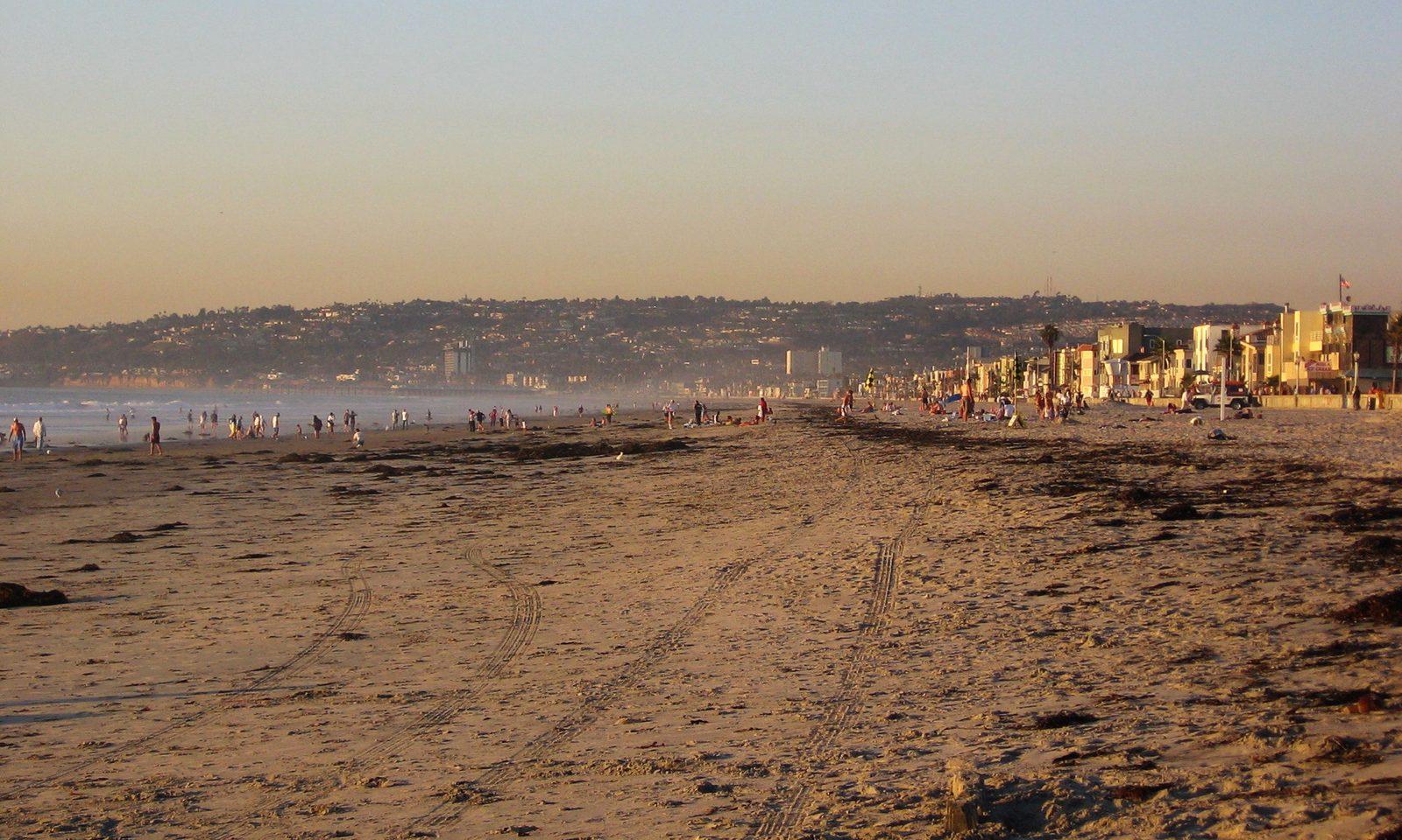 Beachgoers at Mission Beach. County health officials advise staying in air-conditioned spaces during peak heat and never leaving children, older adults or pets in vehicles.