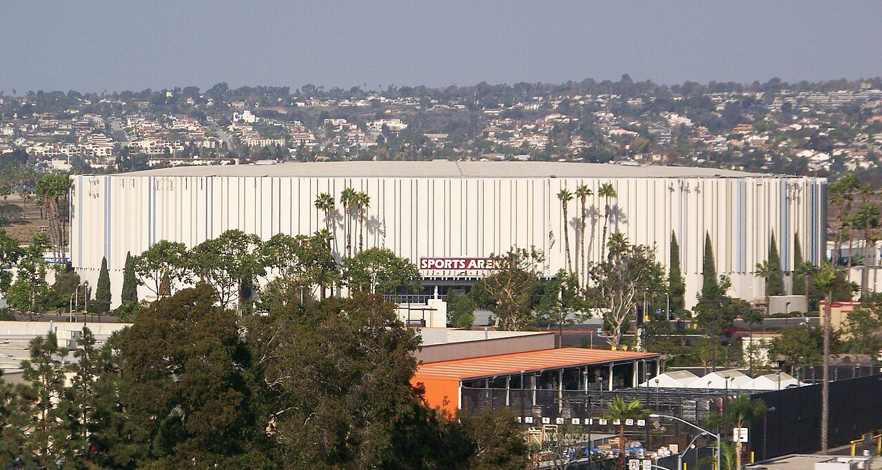 Pechanga Arena, seen from the hills above the Midway district, its Sports Arena sign facing the boulevard below. The Gulls head home from the split with an overtime win on the road in their pocket.