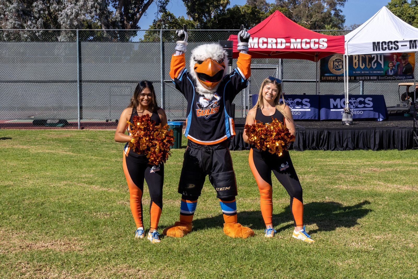 Gulliver, the Gulls' mascot, with two members of the Gulls dance team at Marine Corps Recruit Depot San Diego in October 2024. The roster moves come four games into the Gulls' season.