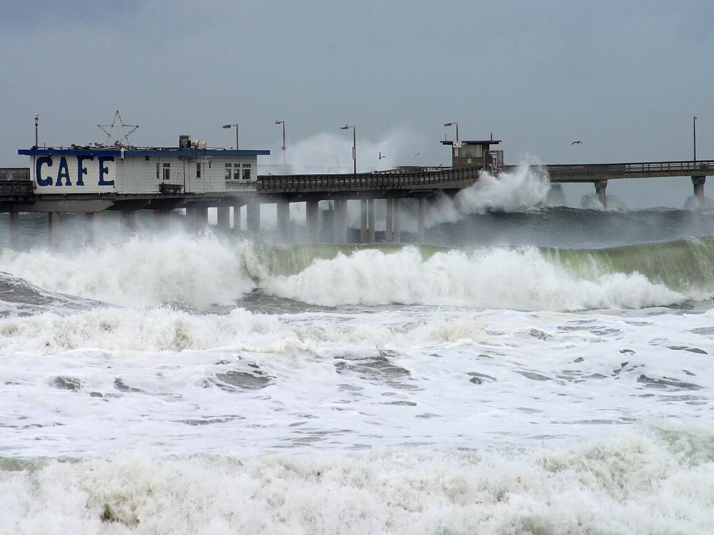 Huge waves crash over the Ocean Beach pier during the December 2002 El Nino. Forecasters say Rachel will bring similar pounding surf and dangerous coastal flooding Sunday.