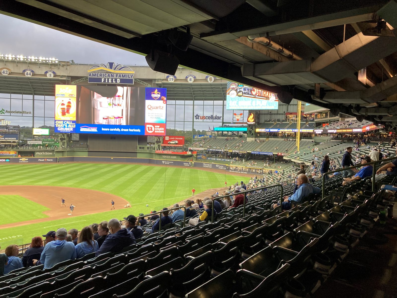 American Family Field in Milwaukee before a September 2025 game, the retractable roof open. On Saturday night the roof was closed, and its cables were in play: Ty France's ninth-inning drive struck one and was caught for an out.